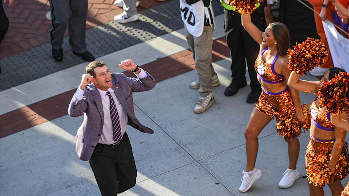 Nov 2, 2024; Clemson, South Carolina, USA; Clemson Tigers head coach Dabo Swinney pumps his fists and greets fans during Tiger Walk before a game against the Louisville Cardinals at Memorial Stadium. 