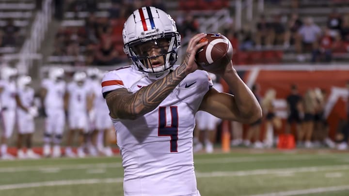 Sep 28, 2024; Salt Lake City, Utah, USA; Arizona Wildcats wide receiver Tetairoa McMillan (4) warms up before a game against the Utah Utes at Rice-Eccles Stadium. 