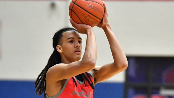Holliday's Keitenn Bristow shoots a three during the bi-district playoffs against Early on Monday, February 19, 2024 at Graham High School.
