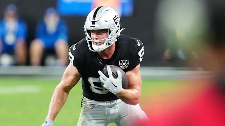 Dec 22, 2024; Paradise, Nevada, USA; Las Vegas Raiders tight end Brock Bowers (89) gains yardage after making a catch against the Jacksonville Jaguars during the fourth quarter at Allegiant Stadium. Mandatory Credit: Stephen R. Sylvanie-Imagn Images