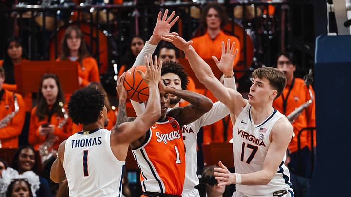 Feb 7, 2026; Charlottesville, Virginia, USA; Syracuse Orange forward Donnie Freeman (1) battles through Virginia Cavaliers defenders during the second half at John Paul Jones Arena. Mandatory Credit: Emily Faith Morgan-Imagn Images