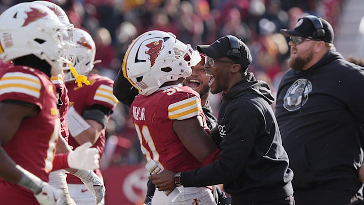 Iowa State Cyclones' defensive back Marcus Neal Jr. (31) celebrates with passsing game coach Deon Broomfield after an interception against Kansas during the fourth quarter in the senior day on Nov. 22, 2025, at Jack Trice Stadium in Ames, Iowa