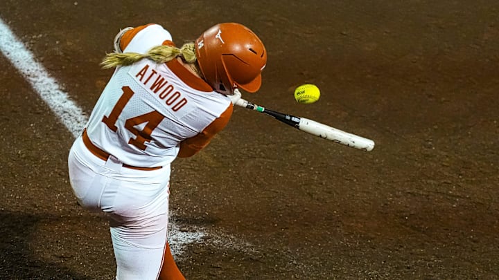 Texas Longhorns catcher Reese Atwood (14) swings at a pitch during the game against Texas Tech on day one of the Bevo Classic at Red and Charline McCombs field on Friday, February. 14, 2025 in Austin.