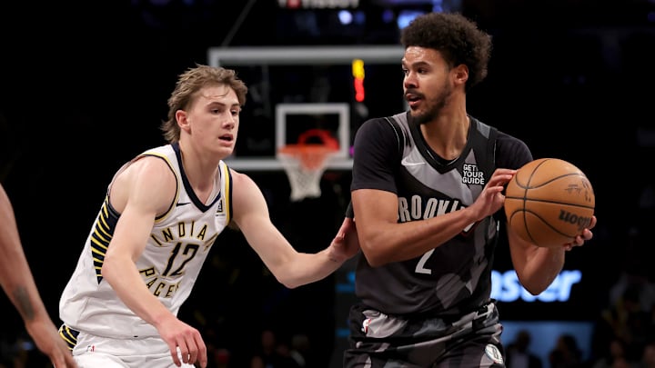 Dec 4, 2024; Brooklyn, New York, USA; Brooklyn Nets forward Cameron Johnson (2) looks to pass the ball against Indiana Pacers forward Johnny Furphy (12) during the third quarter at Barclays Center. Mandatory Credit: Brad Penner-Imagn Images
