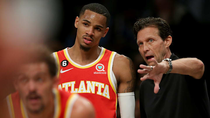 Mar 31, 2023; Brooklyn, New York, USA; Atlanta Hawks head coach Quin Snyder talks to guard Dejounte