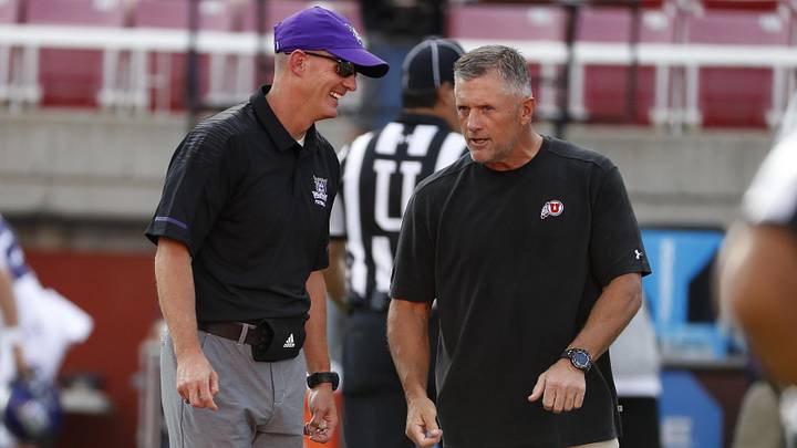 Aug 30, 2018; Salt Lake City, UT, USA; Weber State Wildcats head coach Jay Hill, left and Utah Utes head coach Kyle Whittingham get together prior to their game at Rice-Eccles Stadium. Mandatory Credit: Jeff Swinger-Imagn Images