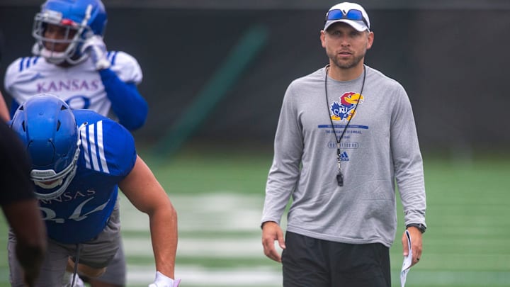 Kansas defensive back coach Jordan Peterson watches players run drills during practice