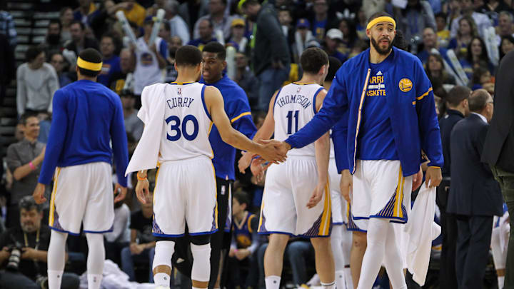 Apr 4, 2017; Oakland, CA, USA; Golden State Warriors guard Stephen Curry (30) celebrates with center JaVale McGee (1) during the fourth quarter against the Minnesota Timberwolves at Oracle Arena. The Warriors defeated the Timberwolves 121-107. Mandatory Credit: Sergio Estrada-Imagn Images