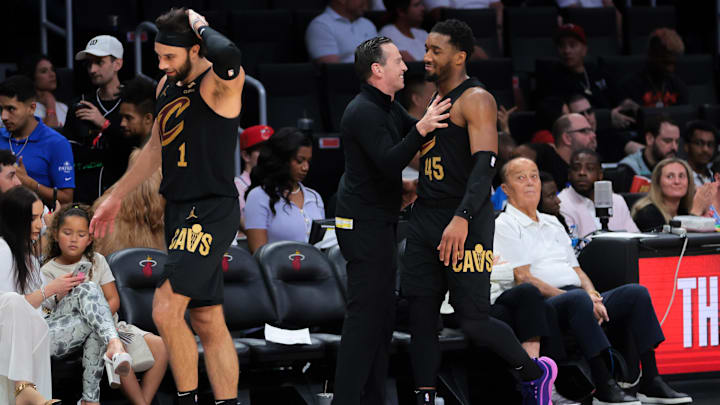 Apr 26, 2025; Miami, Florida, USA; Cleveland Cavaliers guard Donovan Mitchell (45) celebrates with head coach Kenny Atkinson in the fourth quarter against the Miami Heat during game three for the first round of the 2025 NBA Playoffs at Kaseya Center. Mandatory Credit: Sam Navarro-Imagn Images Apr 26, 2025; Miami, Florida, USA; Cleveland Cavaliers guard Donovan Mitchell (45) celebrates with head coach Kenny Atkinson in the fourth quarter against the Miami Heat during game three for the first round of the 2025 NBA Playoffs at Kaseya Center. Mandatory Credit: Sam Navarro-Imagn Images