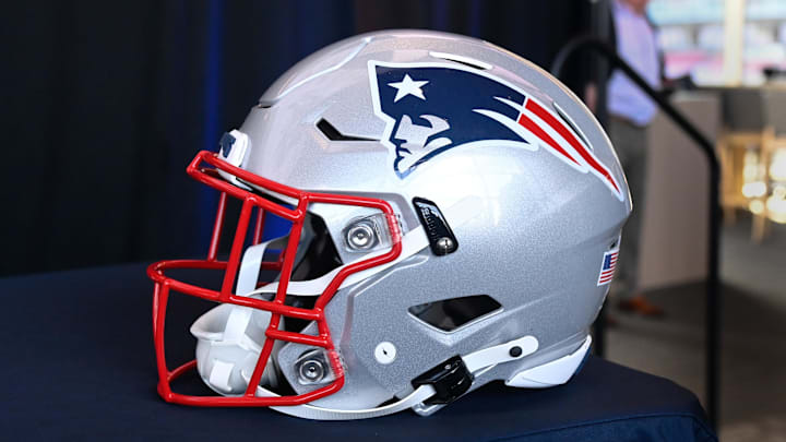 Jan 17, 2024; Foxborough, MA, USA; A New England Patriots helmet sits on a table prior to a press conference at Gillette Stadium. Mandatory Credit: Eric Canha-Imagn Images Jan 17, 2024; Foxborough, MA, USA; A New England Patriots helmet sits on a table prior to a press conference at Gillette Stadium. Mandatory Credit: Eric Canha-Imagn Images
