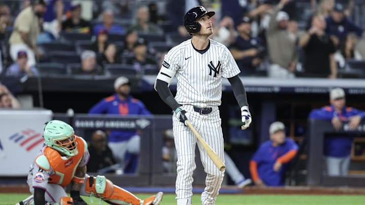 May 18, 2025; Bronx, New York, USA;  New York Yankees left fielder Cody Bellinger (35) hits a grand slam home run in the eighth inning against the New York Mets at Yankee Stadium. Mandatory Credit: Wendell Cruz-Imagn Images