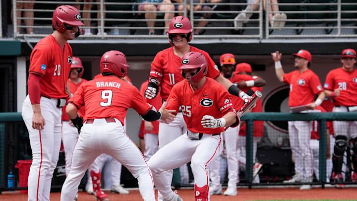 Georgia catcher Daniel Jackson (25) celebrates with Georgia infielder Kolby Branch (9) after hitting a home run during a NCAA Regionals game against Binghamton in Athens, Ga., on Friday, May 30, 2025. Georgia catcher Daniel Jackson (25) celebrates with Georgia infielder Kolby Branch (9) after hitting a home run during a NCAA Regionals game against Binghamton in Athens, Ga., on Friday, May 30, 2025.