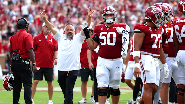 Sep 13, 2025; Tuscaloosa, Alabama, USA; Alabama Crimson Tide players and staff celebrate the start of the 4th quarter during the second half against the Wisconsin Badgers at Saban Field at Bryant-Denny Stadium. 