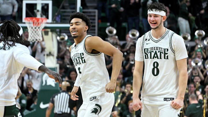 Jan 19, 2025; East Lansing, Michigan, USA;  Michigan State Spartans guard Jaden Akins (3) and forward Frankie Fidler (8) celebrate as the clock expires and the Michigan State Spartans defeat the Illinois Fighting Illini at Jack Breslin Student Events Center. Mandatory Credit: Dale Young-Imagn Images