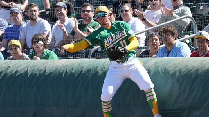 Mar 6, 2026; Mesa, Arizona, USA; Athletics third baseman Brett Harris (11) makes the play for an out against the Colorado Rockies in the first inning at Hohokam Stadium. Mandatory Credit: Rick Scuteri-Imagn Images
