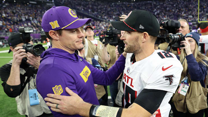 Minnesota Vikings coach Kevin O'Connell and Atlanta Falcons QB Kirk Cousins embrace at mid field. 