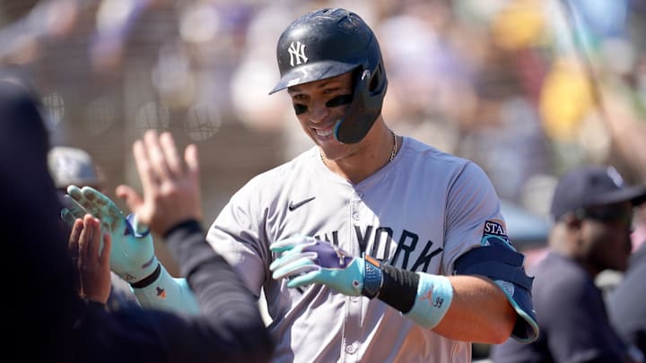 Sep 22, 2024; Oakland, California, USA; New York Yankees center fielder Aaron Judge (99) is congratulated by teammates after hitting a home run against the Oakland Athletics in the third inning at the Oakland-Alameda County Coliseum. Mandatory Credit: Cary Edmondson-Imagn Images
