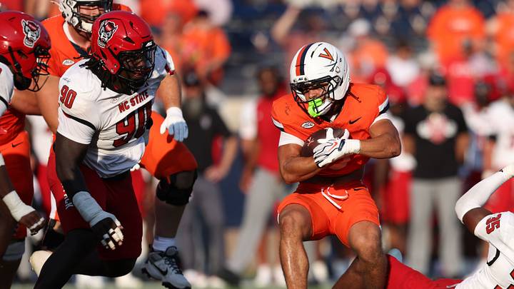 Aug 29, 2026; Charlottesville, Virginia, USA; Virginia Cavaliers running back Noah Vaughn (3) rushes the ball during the game against the NC State Wolfpack at Scott Stadium. Mandatory Credit: Greg Atkins-Imagn Images Aug 29, 2026; Charlottesville, Virginia, USA; Virginia Cavaliers running back Noah Vaughn (3) rushes the ball during the game against the NC State Wolfpack at Scott Stadium. Mandatory Credit: Greg Atkins-Imagn Images