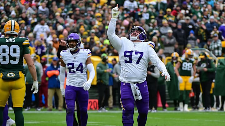 Oct 29, 2023; Green Bay, Wisconsin, USA; Minnesota Vikings defensive tackle Harrison Phillips (97) reacts after making a stop in the third quarter against the Green Bay Packers at Lambeau Field. Oct 29, 2023; Green Bay, Wisconsin, USA; Minnesota Vikings defensive tackle Harrison Phillips (97) reacts after making a stop in the third quarter against the Green Bay Packers at Lambeau Field.