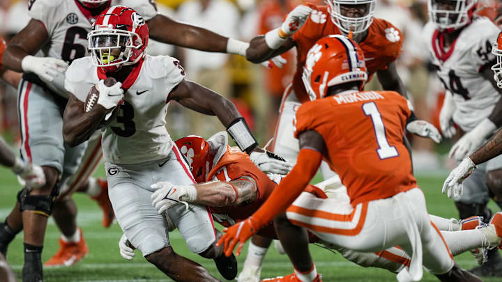 Georgia Bulldogs running back Zamir White (3) is tackled by Clemson Tigers linebacker James Skalski (47) 
