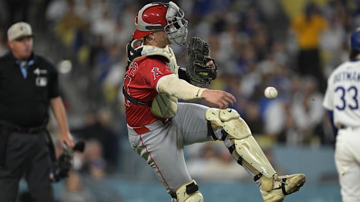 May 16, 2025; Los Angeles, California, USA; Los Angeles Angels catcher Logan O'Hoppe (14) attempts to throw a runner out at second in the eighth inning against the Los Angeles Dodgers at Dodger Stadium. Mandatory Credit: Jayne Kamin-Oncea-Imagn Images