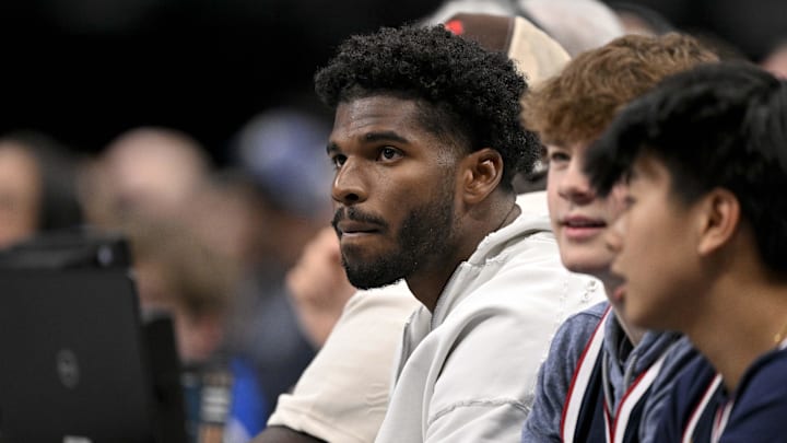 Jan 14, 2025; Dallas, Texas, USA; Colorado Buffaloes quarterback Shedeur Sanders watches the game between the Dallas Mavericks and the Denver Nuggets during the second quarter at the American Airlines Center. Mandatory Credit: Jerome Miron-Imagn Images