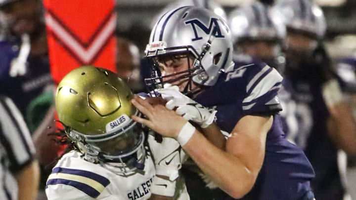 Salesianum's Jasir Gaymon (left) works to hold on to a reception against Malvern Prep's Danny Riely in the second half of Malvern Prep's 27-3 win over Salesianum at Abessinio Stadium, Friday, Sept. 20, 2024.