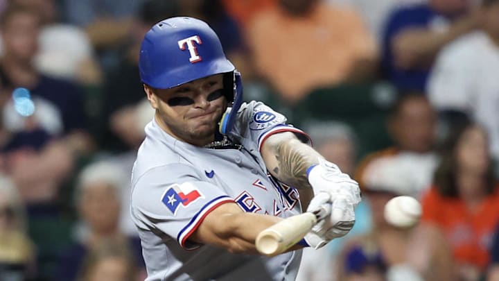 Texas Rangers second baseman Cody Freeman (39) hits a RBI single against the Houston Astros in the second inning at Daikin Park. 