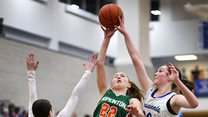 Hillers #22 Teagan Resteghini gets her shot rejected by Presidents #25 Lilliana Catrambone and Niamh Gendron.

The Quincy High Presidents hosted the Hopkinton Hillers in girls MIAA basketball playoffs on Friday, March. 1, 2024