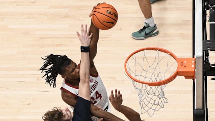 Jan 11, 2025; Stanford, California, USA; Stanford Cardinal forward Jaylen Thompson (24) dunks over Virginia Cavaliers forward Anthony Robinson (21) and forward TJ Power (23) in the second half at Maples Pavilion. Mandatory Credit: Eakin Howard-Imagn Images Jan 11, 2025; Stanford, California, USA; Stanford Cardinal forward Jaylen Thompson (24) dunks over Virginia Cavaliers forward Anthony Robinson (21) and forward TJ Power (23) in the second half at Maples Pavilion. Mandatory Credit: Eakin Howard-Imagn Images