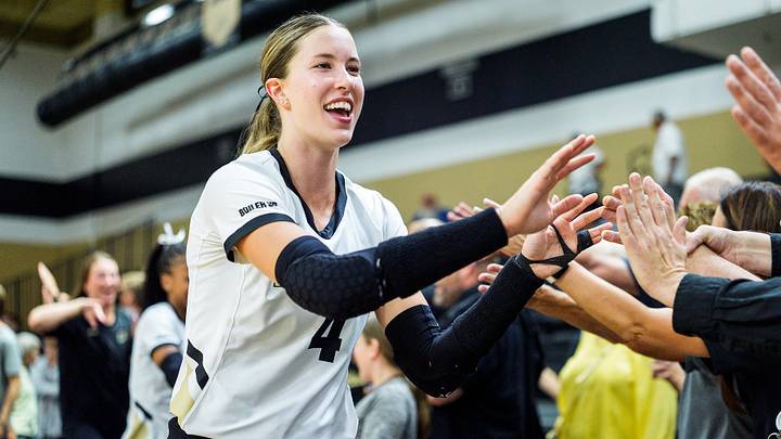 Purdue volleyball's Kenna Wollard celebrates with fans. Purdue volleyball's Kenna Wollard celebrates with fans.