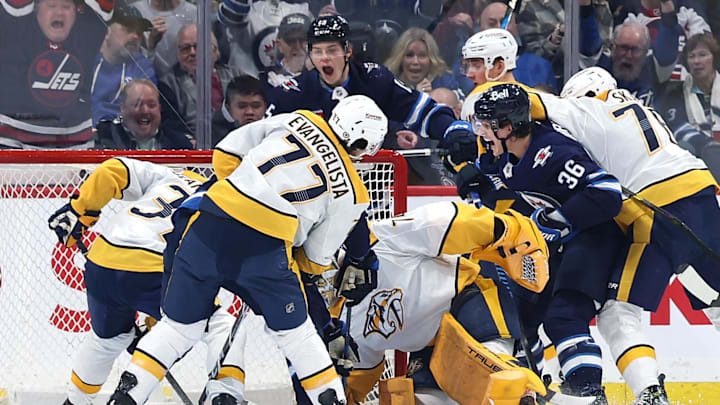 Jan 7, 2025; Winnipeg, Manitoba, CAN; Winnipeg Jets center Morgan Barron (36) celebrates his first period goal on Nashville Predators goaltender Juuse Saros (74) at Canada Life Centre. Mandatory Credit: James Carey Lauder-Imagn Images