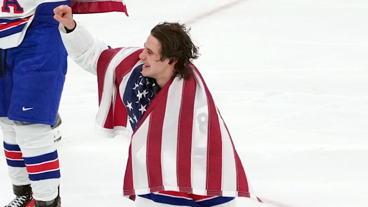 Feb 22, 2026; Milan, Italy; Jack Hughes of the United States celebrates after winning the men's ice hockey gold medal game during the Milano Cortina 2026 Olympic Winter Games at Milano Santagiulia Ice Hockey Arena. Mandatory Credit: James Lang-Imagn Images Feb 22, 2026; Milan, Italy; Jack Hughes of the United States celebrates after winning the men's ice hockey gold medal game during the Milano Cortina 2026 Olympic Winter Games at Milano Santagiulia Ice Hockey Arena. Mandatory Credit: James Lang-Imagn Images