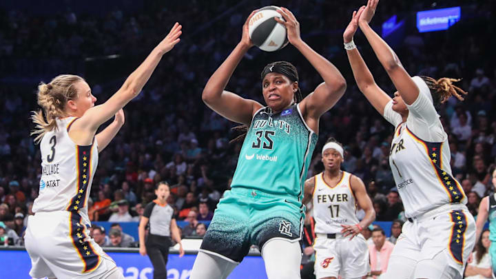 Jun 2, 2024; Brooklyn, New York, USA;  New York Liberty forward Jonquel Jones (35) and Indiana Fever guard Kristy Wallace (3) and forward NaLyssa Smith (1) at Barclays Center. Mandatory Credit: Wendell Cruz-Imagn Images