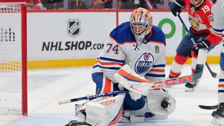 Jun 17, 2025; Sunrise, Florida, USA; Edmonton Oilers goaltender Stuart Skinner (74) makes a glove save against the Florida Panthers during the second period in game six of the 2025 Stanley Cup Final at Amerant Bank Arena. Mandatory Credit: Sam Navarro-Imagn Images