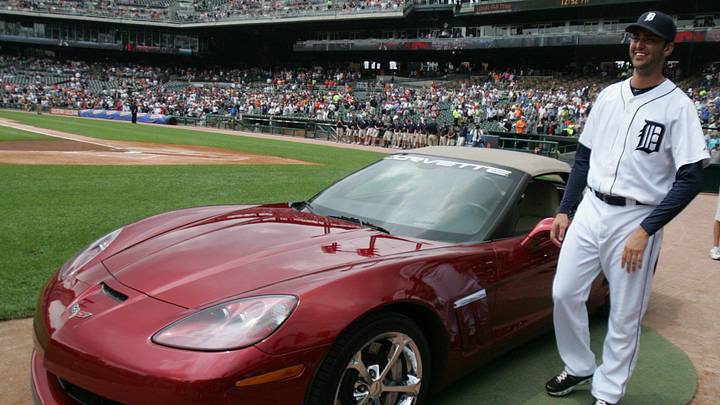 Armando Galarraga with the new red Chevrolet Corvette given to him by General Motors before the Detroit Tigers game Thursday, June 3, 2010 at Comerica Park in Detroit.