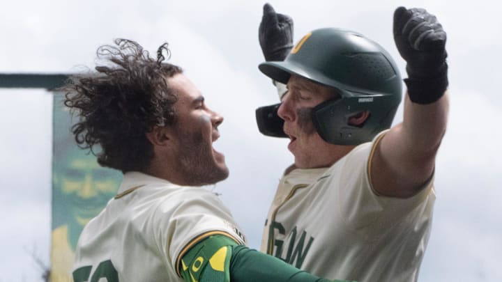 Oregon’s Angel Laya, left, celebrates his second home run of the game with Burke-Lee Mabeus during the game against Nebraska at PK Park in Eugene April 12, 2026.
