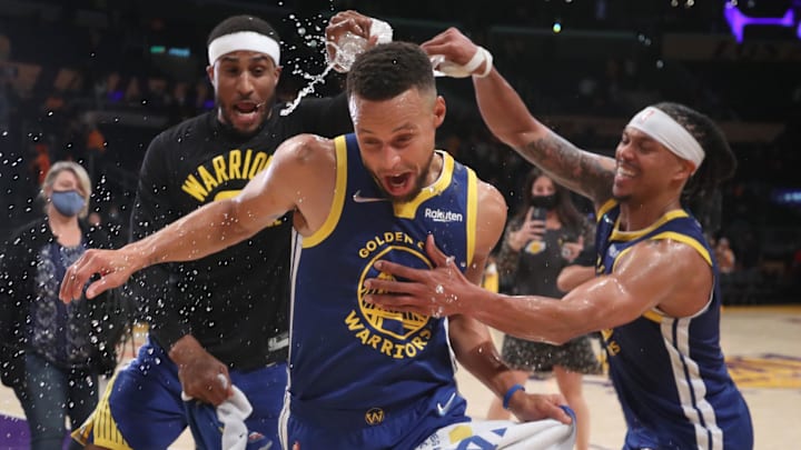 Oct 19, 2021; Los Angeles, California, USA; Golden State Warriors guard Stephen Curry (30) escapes from guard Gary Payton II (0) and guard Damion Lee (1) after the Warriors defeated the Los Angeles Lakers 121-114 at Staples Center. Mandatory Credit: Kiyoshi Mio-Imagn Images