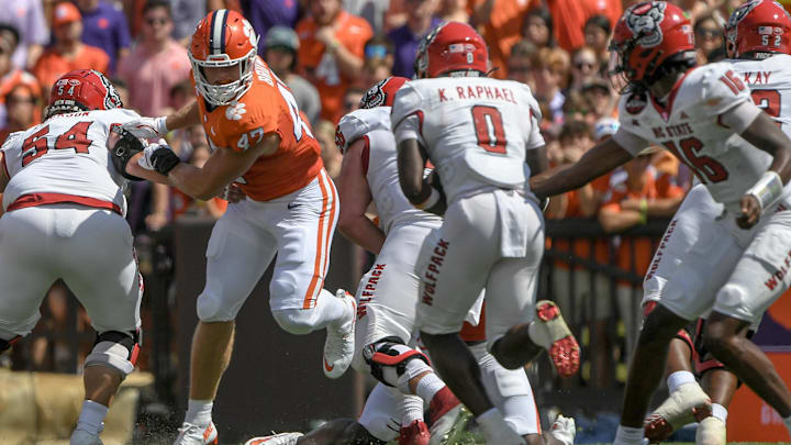 Sep 21, 2024; Clemson, South Carolina, USA; Clemson Tigers linebacker Sammy Brown (47) eyes North Carolina State Wolfpack running back Kendrick Raphael (0) before tackling him for a loss during the first quarter at Memorial Stadium. 