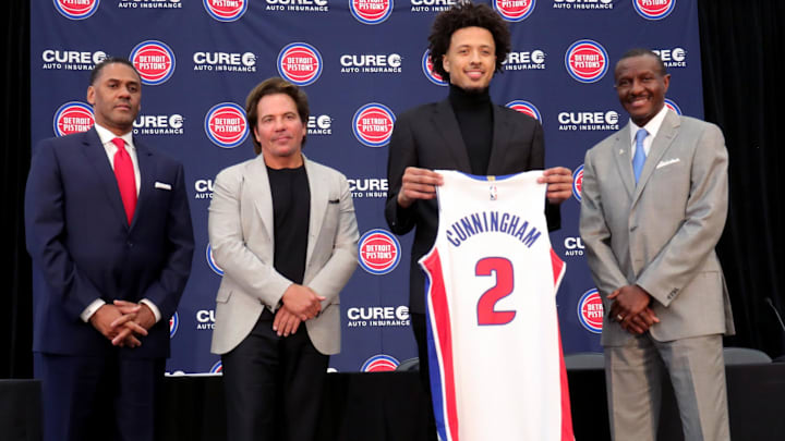 Jul 30, 2021; Detroit, Michigan, USA; Detroit Pistons introduced first round pick Cade Cunningham Friday, July 30, 2021.  GM Troy Weaver, owner Tom Gores first round pick Cade Cunningham and head coach Dwane Casey pose after the press conference. Mandatory credit: Kirthmon F. Dozier/Detroit Free Press via USA TODAY NETWORK