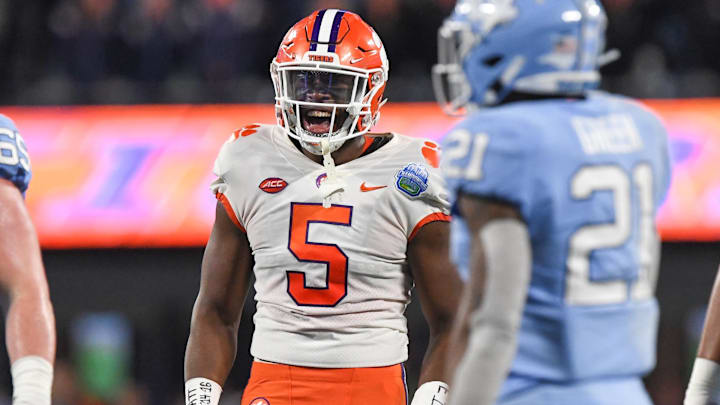 Clemson defensive end K.J. Henry (5)  celebrates a defensive play near North Carolina defensive back Dontavius Nash (21) during the first quarter of the ACC Championship football game at Bank of America Stadium in Charlotte, North Carolina Saturday, Dec 3, 2022.

Clemson Tigers Football Vs North Carolina Tar Heels Acc Championship Charlotte Nc