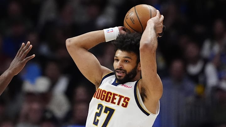 Mar 12, 2025; Denver, Colorado, USA; Denver Nuggets guard Jamal Murray (27) prepares to pass the ball in the first quarter against the Minnesota Timberwolves at Ball Arena. Mandatory Credit: Ron Chenoy-Imagn Images