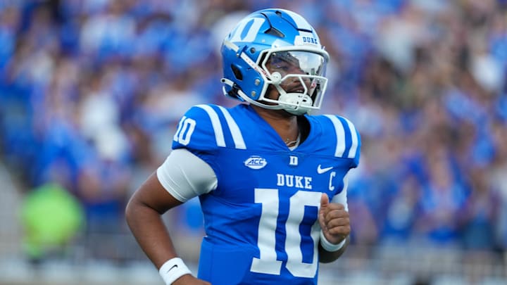 Aug 28, 2025; Durham, North Carolina, USA;  Duke Blue Devils quarterback Darian Mensah (10) comes running out onto the field before the start of the game against the Elon Phoenix at Wallace Wade Stadium. Mandatory Credit: James Guillory-Imagn Images