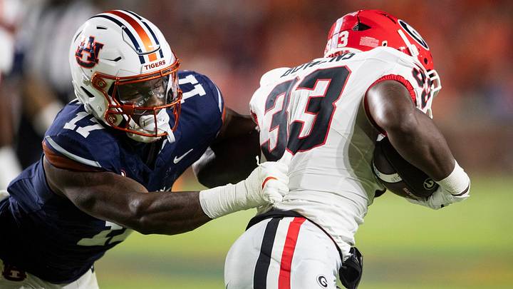 Auburn Tigers linebacker Xavier Atkins (17) tackles Georgia Bulldogs running back Chauncey Bowens (33) as Auburn Tigers take on Georgia Bulldogs at Jordan-Hare Stadium in Auburn, Ala. on Saturday, Oct. 11, 2025. Auburn Tigers lead Georgia Bulldogs 10-3 at halftime.