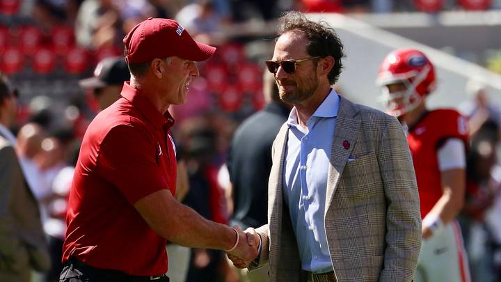 Oklahoma general manager Jim Nagy shakes hands with coach Brent Venables before the Sooners recent game vs. Georgia. Oklahoma general manager Jim Nagy shakes hands with coach Brent Venables before the Sooners recent game vs. Georgia.