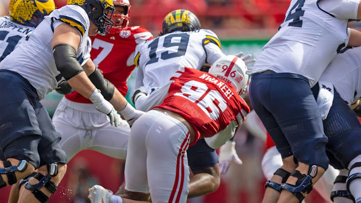 Nebraska defensive lineman Williams Nwaneri pursues Michigan's Bryce Underwood.