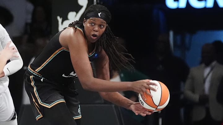 Sep 29, 2024; Brooklyn, New York, USA; New York Liberty forward Jonquel Jones (35) looks to pass the ball against the Las Vegas Aces during game one of the 2024 WNBA Semi-finals at Barclays Center. Mandatory Credit: Gregory Fisher-Imagn Images