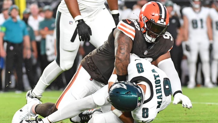 Aug 17, 2023; Philadelphia, Pennsylvania, USA; Cleveland Browns defensive tackle Maurice Hurst (90) sacks Philadelphia Eagles quarterback Marcus Mariota (8) during the first quarter at Lincoln Financial Field. Mandatory Credit: Eric Hartline-USA TODAY Sports