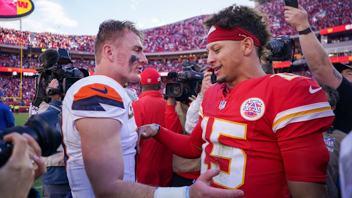 Denver Broncos quarterback Bo Nix (10) talks with Kansas City Chiefs quarterback Patrick Mahomes (15) after the game at GEHA Field at Arrowhead Stadium. Denver Broncos quarterback Bo Nix (10) talks with Kansas City Chiefs quarterback Patrick Mahomes (15) after the game at GEHA Field at Arrowhead Stadium.