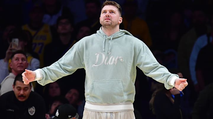 Feb 8, 2025; Los Angeles, California, USA; Los Angeles Lakers guard Luka Doncic (77) reacts watching game action against the Indiana Pacers during the second half at Crypto.com Arena. Mandatory Credit: Gary A. Vasquez-Imagn Images Feb 8, 2025; Los Angeles, California, USA; Los Angeles Lakers guard Luka Doncic (77) reacts watching game action against the Indiana Pacers during the second half at Crypto.com Arena. Mandatory Credit: Gary A. Vasquez-Imagn Images